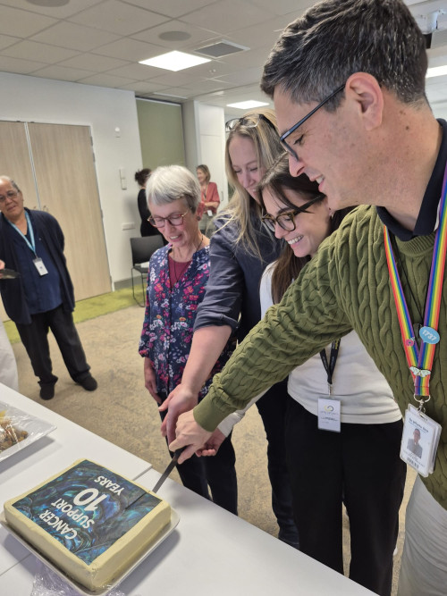 Cancer Psychological & Social Support Services cutting cake